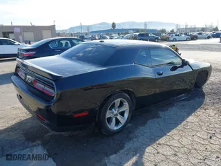 2021 Dodge Challenger SXT with VIN 2C3CDZAG9MH630736, listed as a IAAI auction lot 41633520 with 62,895 mi miles. Bid and sale history available at carsss.com. Image 4.