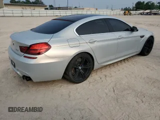 2017 BMW M6 z VIN WBS6E9C56HG437374, wystawiony jako Copart lot #54277624 z przebiegiem 80 858 mil mil oraz . Historia ofert i sprzedaży dostępna na DreamBid. Obrazek 3.