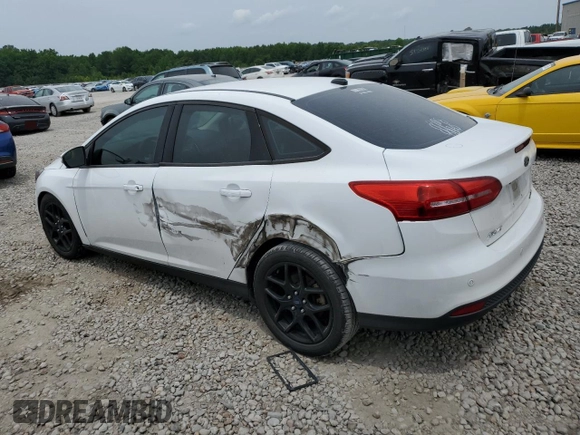 2016 Ford Focus SE with VIN 1FADP3F26GL287849, listed as a Copart auction lot 59980545 with 103,065 mi miles and Salvage title. Bid and sale history available at DreamBid. Image 2.