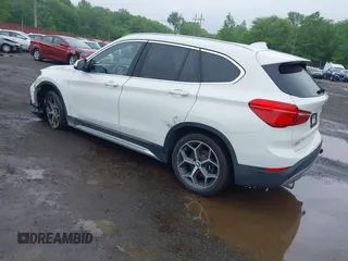 2018 BMW X1 xDrive28i with VIN WBXHT3C38J5L31322, listed as a IAAI auction lot 42260190 with 70,266 mi miles and . Bid and sale history available at DreamBid. Image 3.