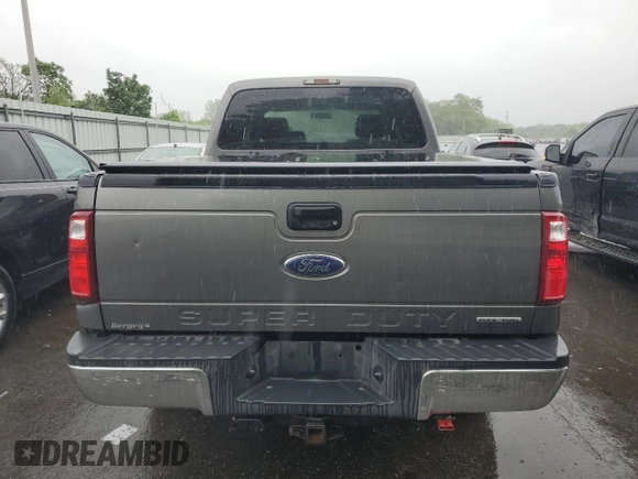 2014 Ford F-250 XL with VIN 1FT7W2B60EEA33908, listed as a Copart auction lot 54752765 with 215,428 mi miles and Salvage title. Bid and sale history available at DreamBid. Image 6.