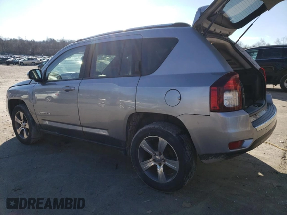 2016 Jeep Compass Latitude with VIN 1C4NJDEB2GD697923, listed as a Copart auction lot 84081394 with 167,240 mi miles and Salvage Title. Bid and sale history available at carsss.com. Image 2.