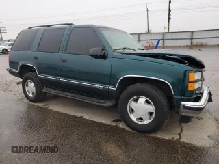 1999 GMC Yukon with VIN 1GKEK13R8XJ798496, listed as a Copart auction lot 81506634 with 117,726 mi miles and Salvage Title. Bid and sale history available at carsss.com. Image 4.