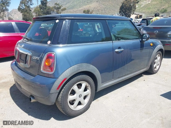 2010 MINI Cooper Hardtop with VIN WMWMF3C56ATZ24156, listed as a IAAI auction lot 41997887 with 149,308 mi miles. Bid and sale history available at carsss.com. Image 4.