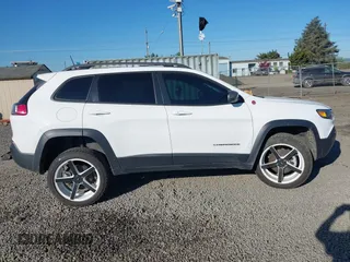 2021 Jeep Cherokee Trailhawk with VIN 1C4PJMBX9MD105888, listed as a IAAI auction lot 42065175 with 55,469 mi miles and . Bid and sale history available at DreamBid. Image 14.