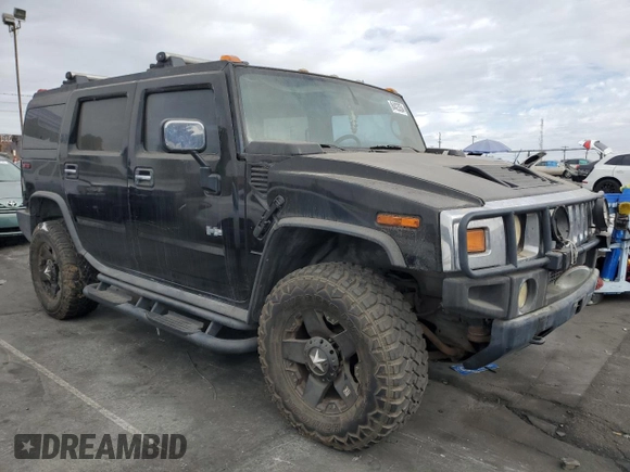 2003 Hummer H2 with VIN 5GRGN23UX3H101416, listed as a Copart auction lot 84423354 with 113,699 mi miles and Clean Title. Bid and sale history available at carsss.com. Image 4.