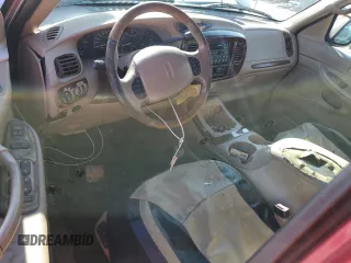 1999 Lincoln Navigator z VIN 5LMRU27A2XLJ41370, wystawiony jako Copart lot #72879004 z przebiegiem Nie podano mil oraz Szkoda całkowita • Salvage title. Historia ofert i sprzedaży dostępna na DreamBid. Obrazek 8.