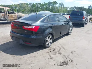2016 Kia Rio EX with VIN KNADN4A34G6575984, listed as a IAAI auction lot 42133630 with 126,704 mi miles. Bid and sale history available at carsss.com. Image 4.