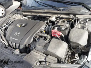 2021 Mazda 3 Premium with VIN JM1BPAML2M1310374, listed as a IAAI auction lot 41190608 with 97,648 mi miles. Bid and sale history available at carsss.com. Image 10.