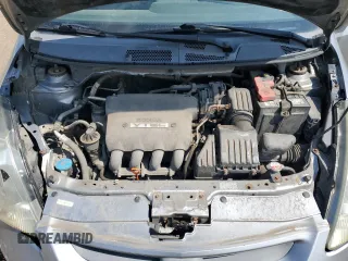 2007 Honda Fit Sport with VIN JHMGD38687S067648, listed as a Copart auction lot 64657345 with 123,055 mi miles and Salvage title. Bid and sale history available at DreamBid. Image 11.