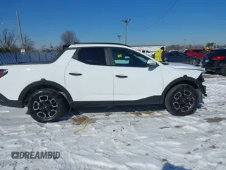 2024 Hyundai Santa Cruz SEL z VIN 5NTJCDAE2RH093666, wystawiony jako IAAI lot #41639659 z przebiegiem 28 599 mil mil oraz . Historia ofert i sprzedaży dostępna na DreamBid. Obrazek 14.