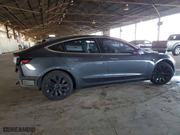 2020 Tesla Model 3 Standard Range Plus with VIN 5YJ3E1EA7LF614913, listed as a Copart auction lot 48518555 with 121,482 mi miles and Salvage Title. Bid and sale history available at carsss.com. Image 3.