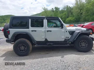 2023 Jeep Wrangler Sport S с VIN 1C4HJXDN0PW511682, выставлен на аукционе IAAI как лот 42199890 с пробегом 29 061 миль миль и . История ставок и продаж доступна на DreamBid. Изображение 13.