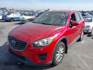 2016 Mazda CX-5 Sport with VIN JM3KE2BY4G0701442, listed as a IAAI auction lot 41682335 with 125,624 mi miles. Bid and sale history available at carsss.com. Image 18.