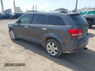 2014 Dodge Journey Limited with VIN 3C4PDDDG8ET199813, listed as a IAAI auction lot 41919196 with 199,096 mi miles and . Bid and sale history available at carsss.com. Image 3.