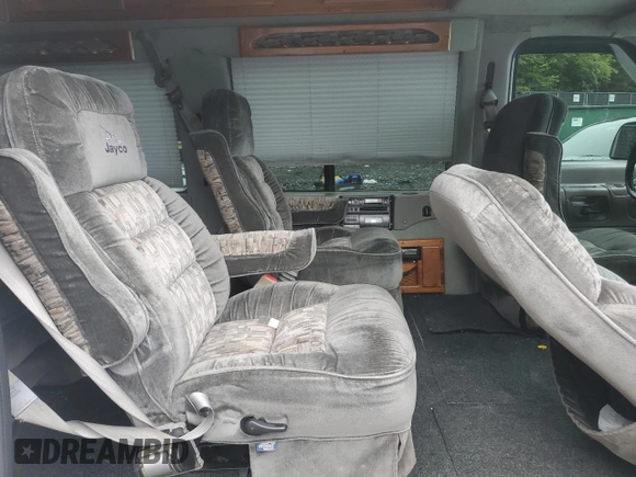 2000 Ford Econoline Cargo Recreational z VIN 1FDRE14L3YHA17676, wystawiony jako Copart lot #58571465 z przebiegiem 174 129 mil mil oraz Szkoda całkowita • Salvage title. Historia ofert i sprzedaży dostępna na DreamBid. Obrazek 11.