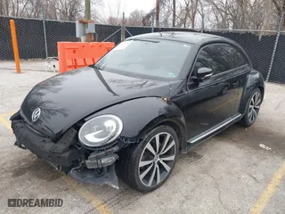 2012 Volkswagen Beetle 2.0T Turbo PZEV with VIN 3VWVA7AT1CM635697, listed as a IAAI auction lot 41552112 with 150,689 mi miles. Bid and sale history available at carsss.com. Image 1.