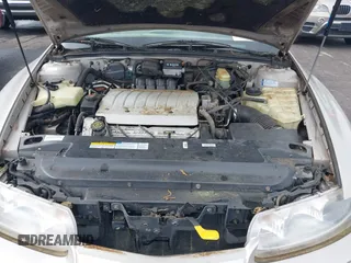1997 Oldsmobile Aurora z VIN 1G3GR62CXV4121200, wystawiony jako IAAI lot #42277003 z przebiegiem 198 048 mil mil oraz . Historia ofert i sprzedaży dostępna na DreamBid. Obrazek 10.