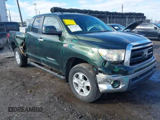 2011 Toyota Tundra with VIN 5TFUY5F10BX165953, listed as a IAAI auction lot 41533552 with 300,586 mi miles and . Bid and sale history available at DreamBid. Image 1.