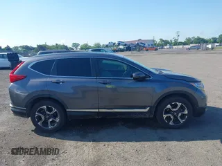 2018 Honda CR-V Touring z VIN 5J6RW2H93JL004834, wystawiony jako IAAI lot #42351364 z przebiegiem 63 746 mil mil oraz . Historia ofert i sprzedaży dostępna na DreamBid. Obrazek 13.