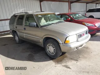 1999 GMC Jimmy SLE with VIN 1GKDT13W7X2529298, listed as a IAAI auction lot 41556249 with 114,750 mi miles. Bid and sale history available at carsss.com. Image 1.