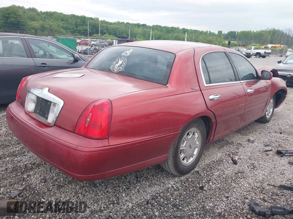 1999 Lincoln Town Car Signature z VIN 1LNFM82WXXY601583, wystawiony jako IAAI lot #42193270 z przebiegiem Nie podano mil oraz . Historia ofert i sprzedaży dostępna na DreamBid. Obrazek 4.