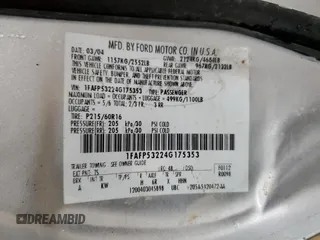 2004 Ford Taurus SE with VIN 1FAFP53224G175353, listed as a Copart auction lot 52713935 with 213,375 mi miles and Salvage Title. Bid and sale history available at DreamBid. Image 12.