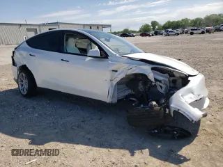 2023 Tesla Model Y Long Range with VIN 7SAYGDEE6PF861451, listed as a Copart auction lot 53133854 with 7,216 mi miles and Salvage Title. Bid and sale history available at DreamBid. Image 4.