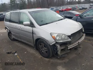 2007 Honda Odyssey EX-L z VIN 5FNRL38777B411148, wystawiony jako IAAI lot #41463521 z przebiegiem 213 223 mil mil oraz . Historia ofert i sprzedaży dostępna na DreamBid. Obrazek 1.