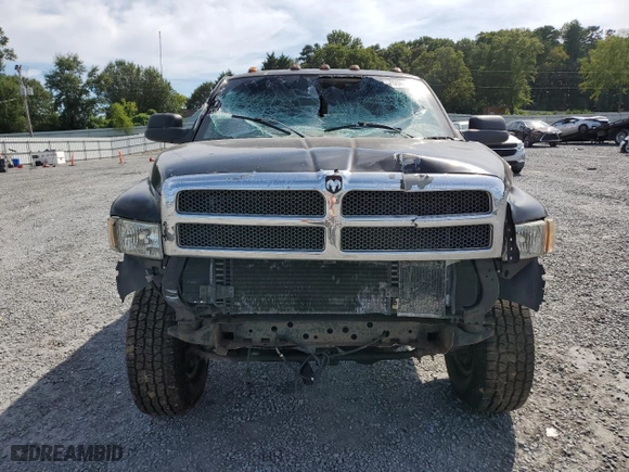 2000 Dodge Ram 2500 with VIN 3B7KF2364YG141972, listed as a Copart auction lot 70001534 with 184,140 mi miles and Salvage Title. Bid and sale history available at carsss.com. Image 5.