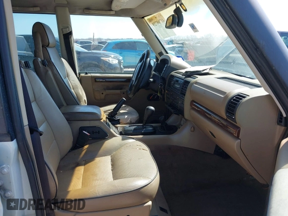 2000 Land Rover Discovery Cloth z VIN SALTY124XYA262828, wystawiony jako IAAI lot #41769729 z przebiegiem 215 711 mil mil oraz . Historia ofert i sprzedaży dostępna na DreamBid. Obrazek 5.
