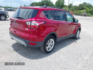 2017 Ford Escape SE z VIN 1FMCU0G95HUE86116, wystawiony jako IAAI lot #42397021 z przebiegiem 115 573 mil mil oraz . Historia ofert i sprzedaży dostępna na DreamBid. Obrazek 4.