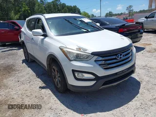 2014 Hyundai Santa Fe z VIN 5XYZUDLB4EG173795, wystawiony jako IAAI lot #42063172 z przebiegiem 173 195 mil mil oraz . Historia ofert i sprzedaży dostępna na DreamBid. Obrazek 1.
