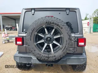 2021 Jeep Wrangler Unlimited Sport S with VIN 1C4HJXDG2MW700461, listed as a IAAI auction lot 41894307 with 82,454 mi miles. Bid and sale history available at carsss.com. Image 16.