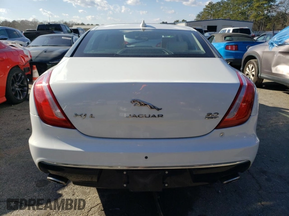 2017 Jaguar XJ with VIN SAJWJ2GD4H8W12163, listed as a Copart auction lot 86993064 with 63,697 mi miles and Salvage Title. Bid and sale history available at carsss.com. Image 6.