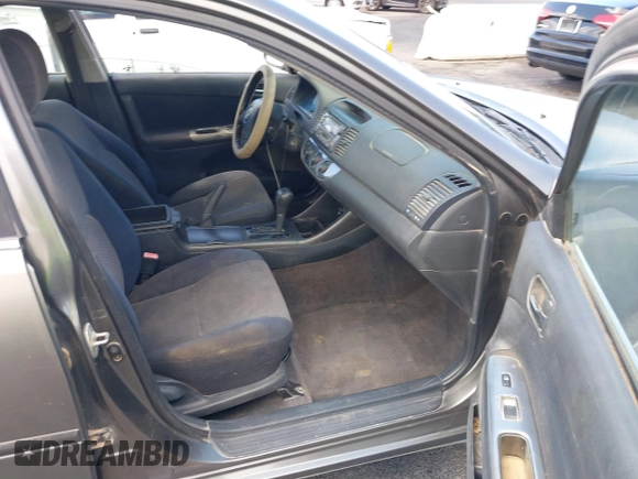 2003 Toyota Camry LE with VIN JTDBE32K130149032, listed as a IAAI auction lot 42063174 with 241,424 mi miles and . Bid and sale history available at DreamBid. Image 5.