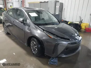 2021 Toyota Prius L Eco with VIN JTDKAMFU9M3132587, listed as a IAAI auction lot 41637275 with 84,203 mi miles. Bid and sale history available at carsss.com. Image 1.