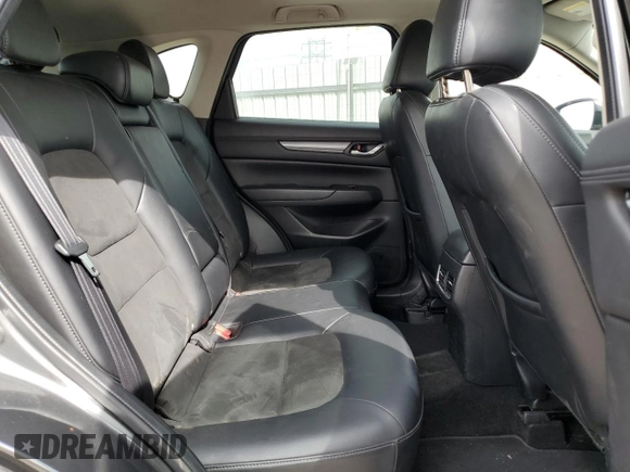 2018 Mazda CX-5 Touring z VIN JM3KFBCM2J0379190, wystawiony jako Copart lot #59233075 z przebiegiem 51 985 mil mil oraz Szkoda całkowita • Salvage title. Historia ofert i sprzedaży dostępna na DreamBid. Obrazek 11.