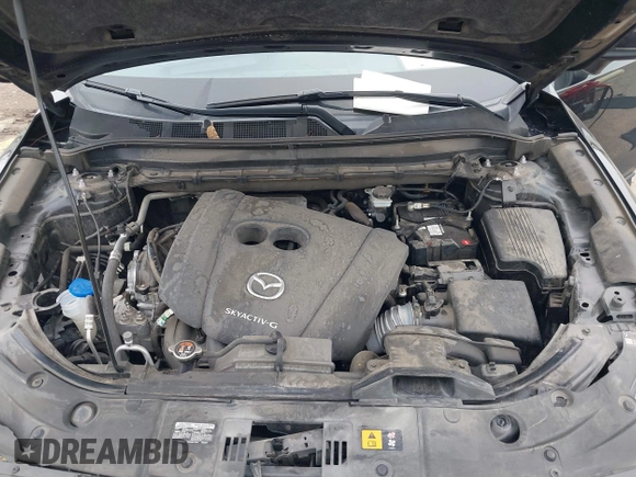 2020 Mazda CX-5 Grand Touring with VIN JM3KFADM8L0811910, listed as a IAAI auction lot 41446214 with 57,849 mi miles. Bid and sale history available at carsss.com. Image 10.