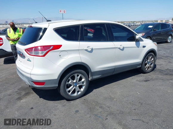 2013 Ford Escape SEL with VIN 1FMCU0HX1DUB99590, listed as a IAAI auction lot 41987910 with 129,954 mi miles. Bid and sale history available at carsss.com. Image 4.