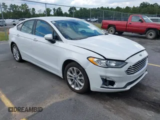 2020 Ford Fusion SE z VIN 3FA6P0HD0LR104379, wystawiony jako IAAI lot #42835458 z przebiegiem 95 621 mil mil oraz . Historia ofert i sprzedaży dostępna na DreamBid. Obrazek 1.