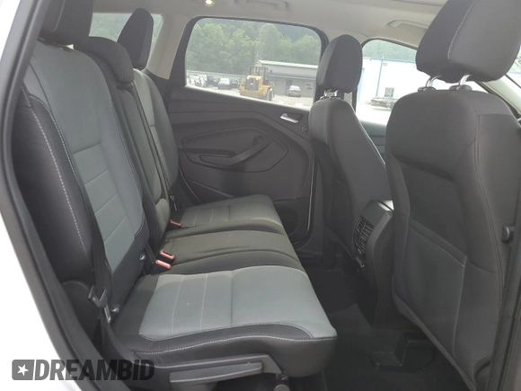 2016 Ford Escape SE z VIN 1FMCU9G97GUB45352, wystawiony jako Copart lot #60001055 z przebiegiem 93 685 mil mil oraz Szkoda całkowita • Salvage title. Historia ofert i sprzedaży dostępna na DreamBid. Obrazek 11.