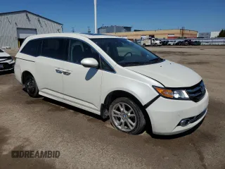 2015 Honda Odyssey Touring Elite with VIN 5FNRL5H92FB504977, listed as a Copart auction lot 56657195 with 189,438 mi miles and Salvage title. Bid and sale history available at DreamBid. Image 4.