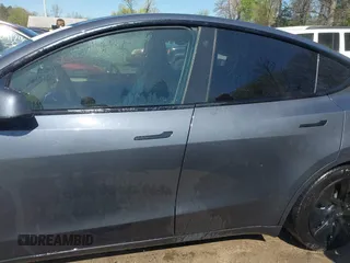 2022 Tesla Model Y Long Range z VIN 7SAYGAEE9NF574634, wystawiony jako IAAI lot #42040719 z przebiegiem 29 675 mil mil oraz . Historia ofert i sprzedaży dostępna na DreamBid. Obrazek 14.
