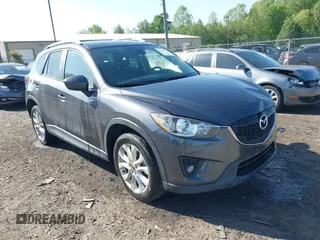 2014 Mazda CX-5 Grand Touring with VIN JM3KE4DY2E0312952, listed as a IAAI auction lot 42138721 with 99,993 mi miles and . Bid and sale history available at DreamBid. Image 1.