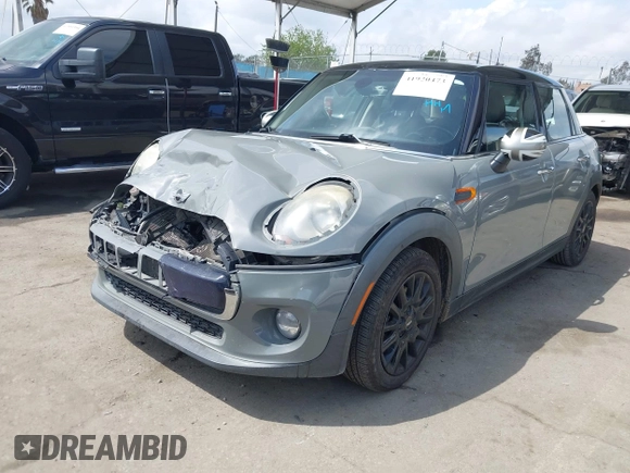 2016 MINI Hardtop 4 Door z VIN WMWXU1C52G2A93506, wystawiony jako IAAI lot #41920473 z przebiegiem 101 635 mil mil oraz . Historia ofert i sprzedaży dostępna na DreamBid. Obrazek 17.