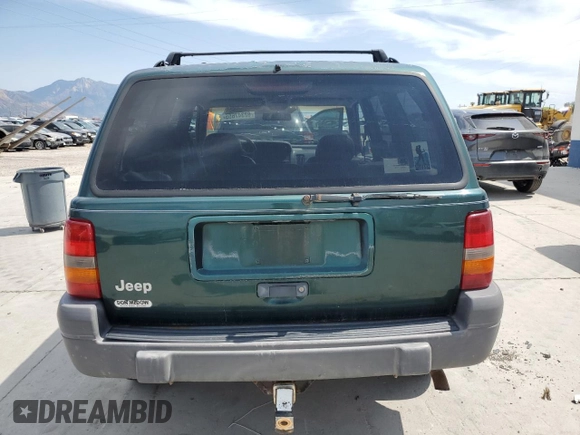 1996 Jeep Grand Cherokee Laredo z VIN 1J4GZ58S8TC222435, wystawiony jako Copart lot #62347665 z przebiegiem 202 125 mil mil oraz Czysty tytuł • Clean title. Historia ofert i sprzedaży dostępna na DreamBid. Obrazek 6.