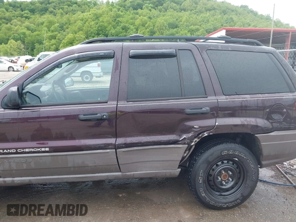 2004 Jeep Grand Cherokee Laredo z VIN 1J4GW48S94C209326, wystawiony jako IAAI lot #42309565 z przebiegiem 159 429 mil mil oraz . Historia ofert i sprzedaży dostępna na DreamBid. Obrazek 6.