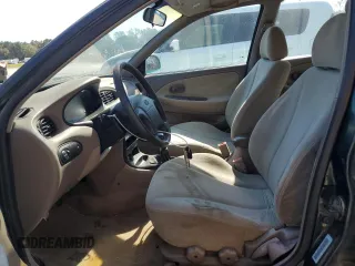 2000 Hyundai Elantra GLS z VIN KMHJF35FXYU998689, wystawiony jako Copart lot #76181814 z przebiegiem 154 743 mil mil oraz Szkoda całkowita • Salvage title. Historia ofert i sprzedaży dostępna na DreamBid. Obrazek 7.