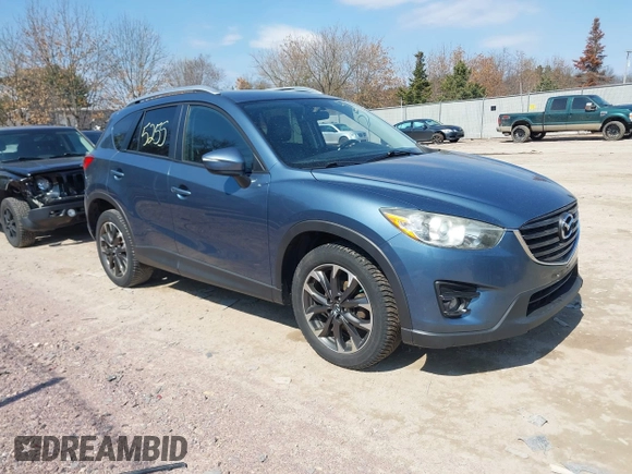 2016 Mazda CX-5 Grand Touring z VIN JM3KE4DY6G0785255, wystawiony jako IAAI lot #41887066 z przebiegiem 171 334 mil mil oraz . Historia ofert i sprzedaży dostępna na DreamBid. Obrazek 1.